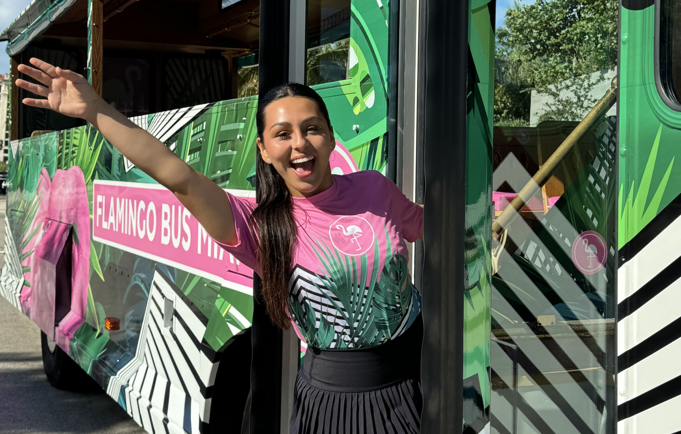 PC4 Friendly Miami bus tour guide providing information to tourists on a city tour, bus route map