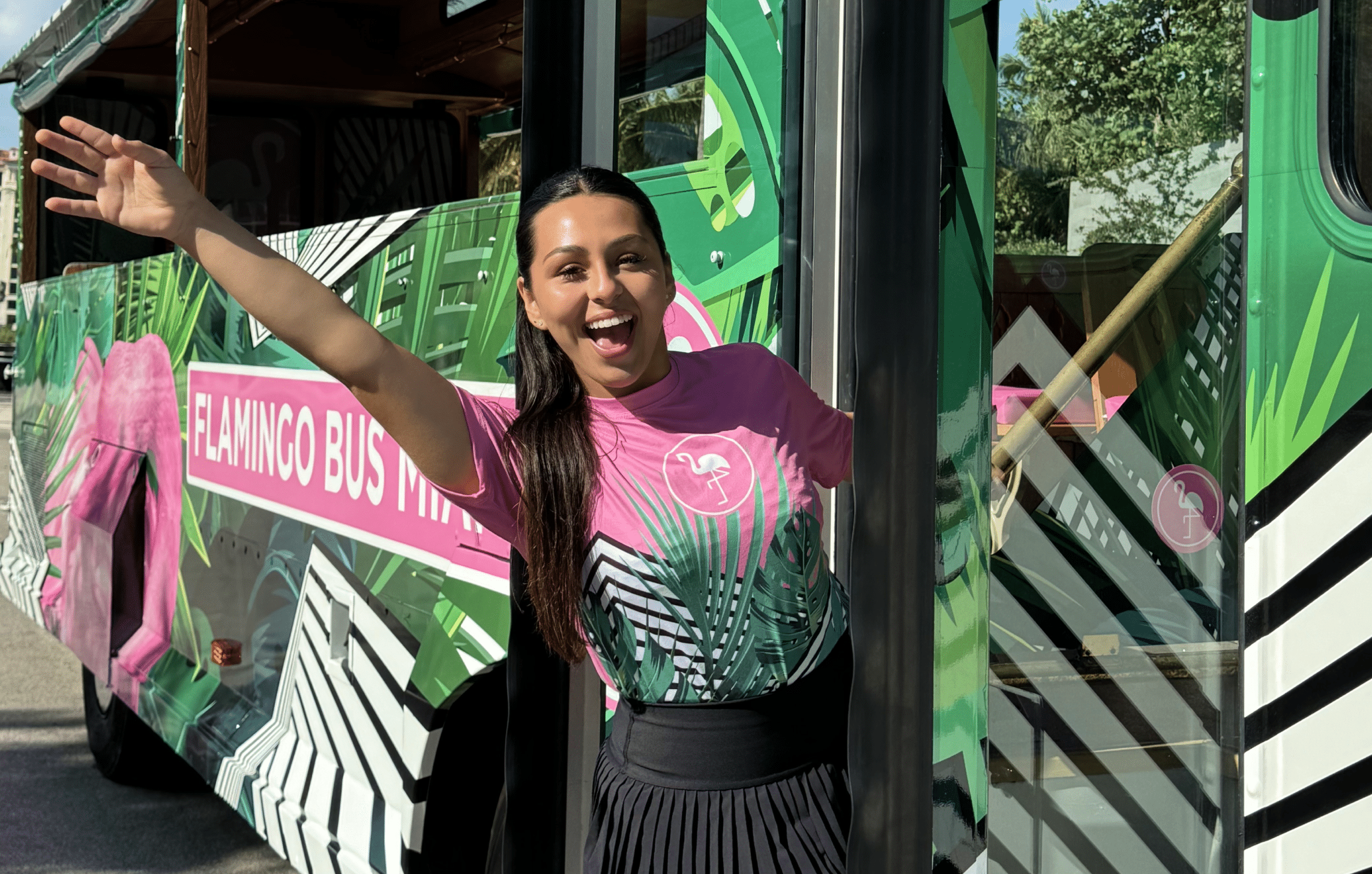 Friendly Miami bus tour guide providing information to tourists on a city tour, bus route map
